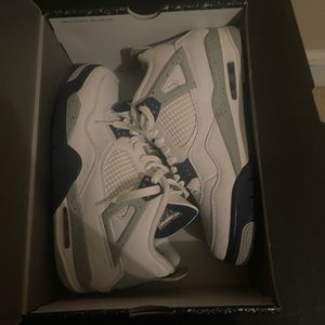 Blue and white Jordan Retro 4